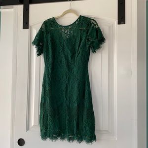 Green lace dress with short sleeves.